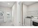 Bright laundry room features modern appliances and storage for convenient chore management at 4607 Mint Leaf Ln, Raleigh, NC 27612