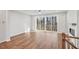 Bright living room features hardwood floors, modern fireplace, and slider to a wood balcony at 4607 Mint Leaf Ln, Raleigh, NC 27612