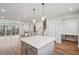 Open concept living room and kitchen area featuring modern design at 4607 Mint Leaf Ln, Raleigh, NC 27612