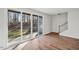 Spacious living room with wood floors and sliding doors leading to a backyard at 4607 Mint Leaf Ln, Raleigh, NC 27612