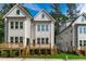 Rear exterior view showing wooden decks and well-maintained yards on these newly built homes at 5049 Lundy Dr # 101, Raleigh, NC 27606