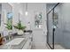 Modern bathroom with a glass-enclosed shower and a double sink vanity with gray countertop at 5049 Lundy Dr # 101, Raleigh, NC 27606