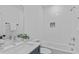 Bright bathroom featuring subway tile, a soaking tub, and a vanity with modern fixtures at 5049 Lundy Dr # 101, Raleigh, NC 27606