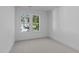 Minimalist bedroom design with neutral colors and ample natural light at 5049 Lundy Dr # 101, Raleigh, NC 27606