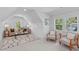 Cozy upstairs living room with stylish rug, comfortable seating, and bright windows at 5049 Lundy Dr # 101, Raleigh, NC 27606