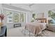 Cozy main bedroom with large windows and a comfortable bed at 5049 Lundy Dr # 101, Raleigh, NC 27606
