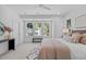 Bright and spacious main bedroom with a plush bed and a large window at 5049 Lundy Dr # 101, Raleigh, NC 27606