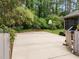 Spacious backyard featuring concrete patio with basketball hoop, perfect for outdoor activities at 5109 Knaresborough Rd, Raleigh, NC 27612