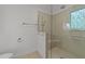 Modern bathroom with a glass-enclosed shower and tiled walls at 5109 Knaresborough Rd, Raleigh, NC 27612