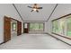 Spacious bedroom with neutral carpet, wood trim, and lots of natural light at 5109 Knaresborough Rd, Raleigh, NC 27612