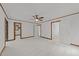 Spacious bedroom with neutral carpet, wood trim, and multiple doorways at 5109 Knaresborough Rd, Raleigh, NC 27612