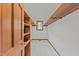 Walk-in closet featuring shelving, hanging rods, and a window for natural light at 5109 Knaresborough Rd, Raleigh, NC 27612