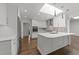 Bright kitchen featuring marble countertops, stainless steel appliances, and a skylight at 5109 Knaresborough Rd, Raleigh, NC 27612
