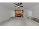 Spacious living room featuring a stone fireplace and plush carpet, perfect for relaxing at 5109 Knaresborough Rd, Raleigh, NC 27612