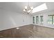 Bright living room with beautiful hardwood floors, skylight, and ample natural light at 5109 Knaresborough Rd, Raleigh, NC 27612