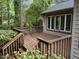 A cozy wooden deck with railings, perfect for relaxing outdoors, is attached to home at 5109 Knaresborough Rd, Raleigh, NC 27612