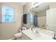 A clean bathroom with a modern toilet, sink, shower, and plenty of towel racks at 540 W Juniper Ave, Wake Forest, NC 27587