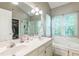 A spacious bathroom with dual sinks, a soaking tub, and a separate shower at 540 W Juniper Ave, Wake Forest, NC 27587