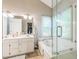 A spacious bathroom with dual sinks, a soaking tub, and a separate shower at 540 W Juniper Ave, Wake Forest, NC 27587