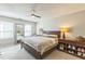 This bedroom features a ceiling fan, two windows, a large mirror, and drawer space at 540 W Juniper Ave, Wake Forest, NC 27587
