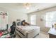 Cozy bedroom featuring a ceiling fan, built-in shelves, and plenty of natural light at 540 W Juniper Ave, Wake Forest, NC 27587