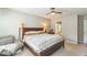 Bedroom featuring a ceiling fan, upholstered chair, and an ensuite bathroom at 540 W Juniper Ave, Wake Forest, NC 27587