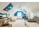 Spacious bonus room with sports decor, a large white sectional, and a comfortable bed at 540 W Juniper Ave, Wake Forest, NC 27587