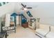 Large bonus room with a white couch, a twin bed, and vibrant sports decorations at 540 W Juniper Ave, Wake Forest, NC 27587