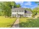 Traditional home boasts a lush front lawn, established landscaping, and a classic facade at 540 W Juniper Ave, Wake Forest, NC 27587