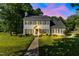 Charming two-story home features a well-manicured lawn, landscaped yard, and inviting front entrance at 540 W Juniper Ave, Wake Forest, NC 27587