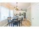 Kitchen with a breakfast nook, modern appliances, white cabinets, and ample natural light at 540 W Juniper Ave, Wake Forest, NC 27587