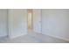 Bedroom with neutral carpet and an open doorway to an en-suite bathroom at 5522 Marthonna Way, Raleigh, NC 27616
