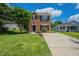 Charming two-story brick home with well-maintained lawn and inviting curb appeal in a residential neighborhood at 5522 Marthonna Way, Raleigh, NC 27616