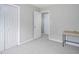 Bedroom with gray carpet, white walls, closet, and a table desk at 5629 Yates Garden Ln, Raleigh, NC 27606