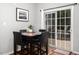 Dining area with table and chairs, view of the patio through the sliding glass doors at 5629 Yates Garden Ln, Raleigh, NC 27606