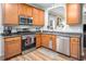 Well-equipped kitchen with stainless steel appliances and ample cabinet space at 5629 Yates Garden Ln, Raleigh, NC 27606