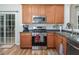 Efficient kitchen layout featuring stainless steel appliances, ample storage, and a breakfast area at 5629 Yates Garden Ln, Raleigh, NC 27606