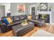 Cozy living room featuring a fireplace, plush seating, and hardwood floors at 5629 Yates Garden Ln, Raleigh, NC 27606