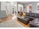 Open living space with hardwood floors, comfortable seating, and a seamless flow at 5629 Yates Garden Ln, Raleigh, NC 27606