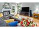 Inviting living room with a fireplace, hardwood floors, and stylish decor at 5629 Yates Garden Ln, Raleigh, NC 27606
