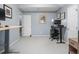 Office space with desk, gray walls and gray carpet at 5629 Yates Garden Ln, Raleigh, NC 27606