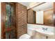 Cozy bathroom featuring a vanity and stained-glass window at 612 Greenwood Rd, Chapel Hill, NC 27514