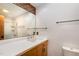 Bright bathroom featuring a white-tiled vanity and a glass-enclosed shower at 612 Greenwood Rd, Chapel Hill, NC 27514