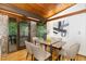 Cozy dining room featuring a modern table, stylish chairs, and access to the outdoors at 612 Greenwood Rd, Chapel Hill, NC 27514