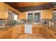 Beautiful kitchen with wood cabinets, stainless steel appliances, and granite countertops at 612 Greenwood Rd, Chapel Hill, NC 27514