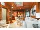 Inviting living room boasts wood paneling, modern furnishings, and a seamless flow to the outdoor scenery at 612 Greenwood Rd, Chapel Hill, NC 27514
