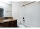 Bathroom with a shower/tub combo, granite countertop and bronze fixtures at 628 Denhoff Dr, Cary, NC 27519