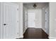 Bright foyer with hardwood floors, white doors, and neutral paint creates a welcoming entrance at 628 Denhoff Dr, Cary, NC 27519