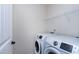 Laundry room featuring updated, white, front-load appliances at 628 Denhoff Dr, Cary, NC 27519