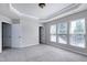 Large main bedroom with a trey ceiling, carpeted floors, and lots of windows at 628 Denhoff Dr, Cary, NC 27519